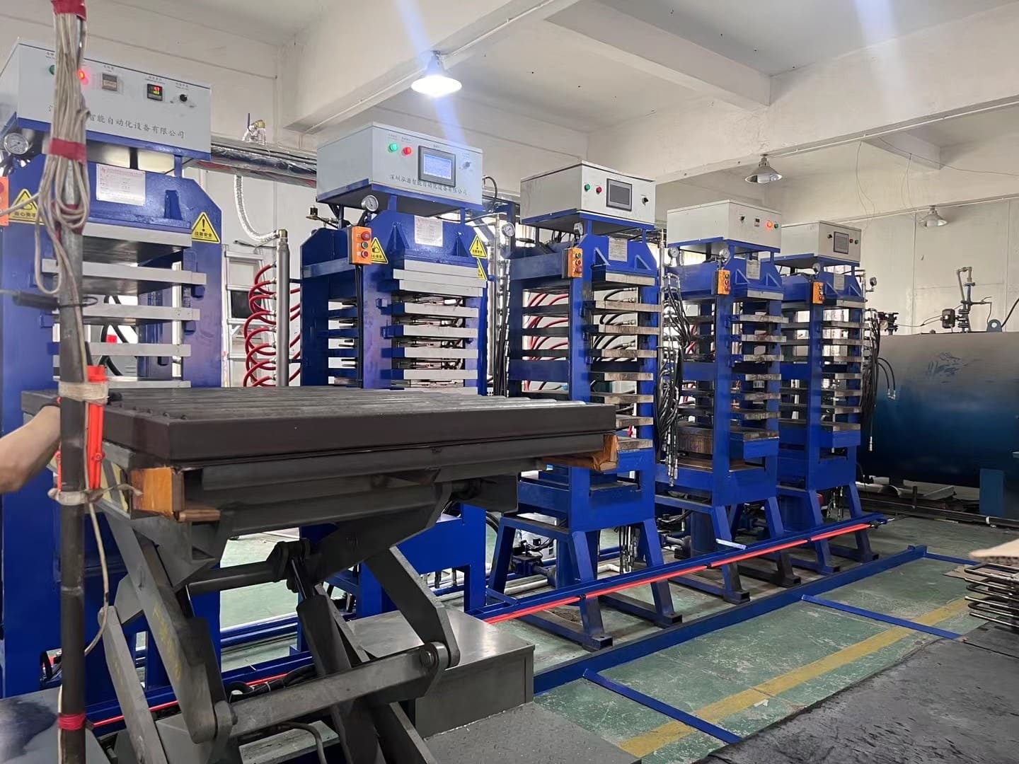 Thermoformed pickleball paddle production machines and high-temperature press line inside a professional paddle manufacturing factory